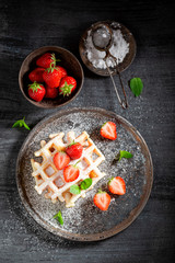 Fresh wafers with fresh strawberries and sugar