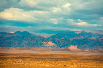 Desert with mountains on the horizon