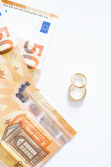 Wedding rings and banknotes