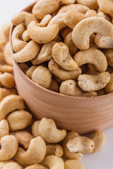 cashew nuts on a white acrylic background