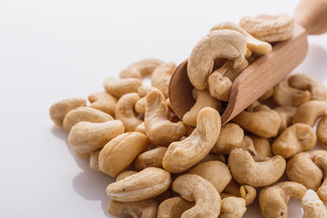 cashew nuts on a white acrylic background