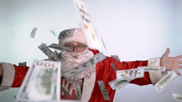 Santa Claus dancing on a white background with money in his hands.

