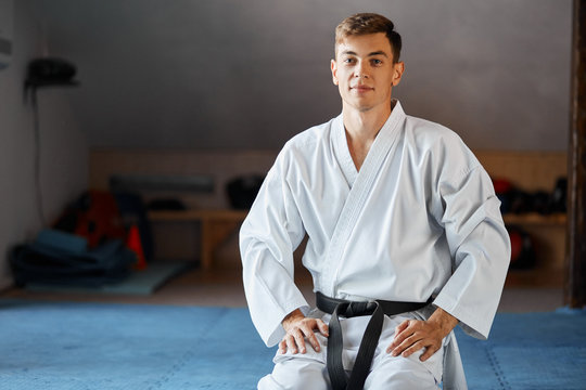 Black Belt Karate Man Sit On Knees Position To Start Or Finish Fight Practicing