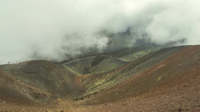 Crater Silvestri Superiori (2001m) on Mount Etna, Etna national park, Sicily, Italy. Silvestri Superiori - lateral crater of the 1892 year eruption. Volcanic foggy landscape. Time Lapse