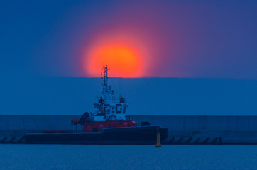 FIREABOAT - Sunrise on a rescue boat moored at the wharf