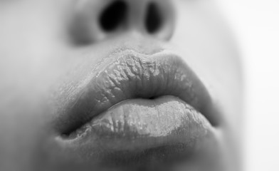 Sensual wet lips. Part of the female face close up. Sexy lips. Macro beautiful woman mouth. Lip care and beauty.