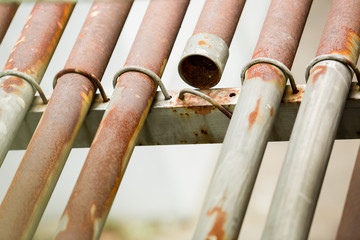 Rusty metal pipe for electric cable.