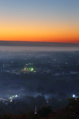 Beautiful scenery during sunrise, Mountains mist of top view at Mandalay hill in Myanma