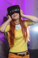 Beautiful, young girl, playing various games, with virtual reality glasses