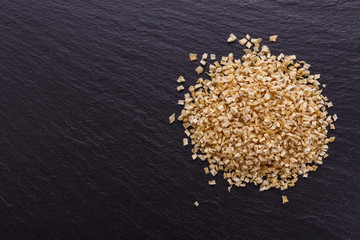 fragrant dried parsnip on a dark stone background