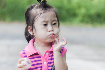 Cute girl to act innocent wearing pink dress