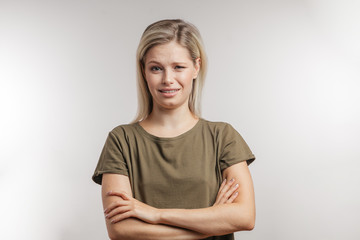 Human emotions and gestures concept. Attractive young woman with blonde hair bun having doubtful...