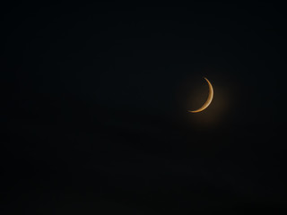 Obraz na płótnie Canvas Half moon in the sky. Beautiful moon on the dark sky. Autumn evening and beautiful moon.