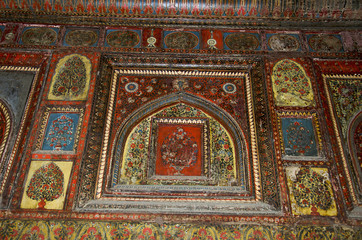 Fototapeta na wymiar Painting on the inner wall and ceiling, Rani Mahal. Jhansi, Uttar Pradesh