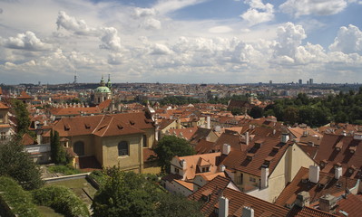 Fototapeta na wymiar Prague landscape, clouds over red roofs.