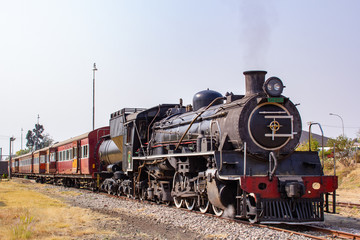 Fototapeta na wymiar old steam locomotive in station