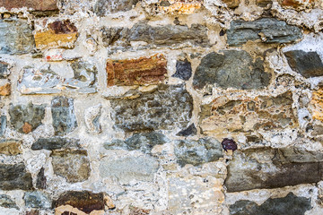 Wall of multi-colored stones