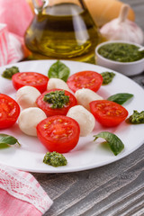 Caprese salad on a wooden rustic background
