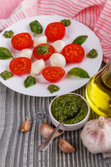 Caprese salad on a wooden rustic background