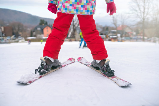 Little girl preparing to ski downhill