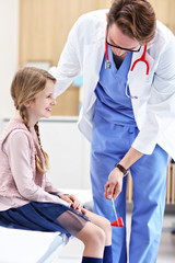 Little girl in clinic having a checkup with neurologist