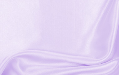 Smooth elegant lilac silk or satin texture as wedding background. Luxurious background design