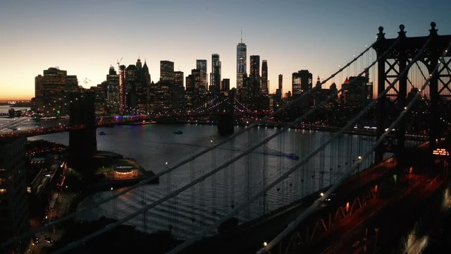 flying over Manhattan Bridge towards dusk view of NYC