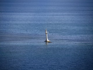 Fototapeta premium Wide shot of a buoy off the shores of Roatan, Honduras