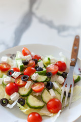 Greek salad on light background