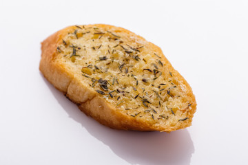 fragrant garlic bread on a white acrylic background
