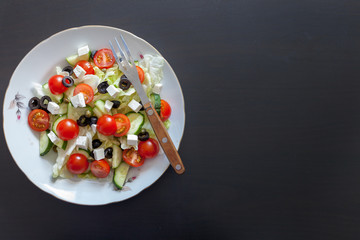 Greek salad on dark background