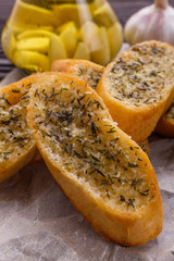 fragrant garlic bread on a rustic wooden background