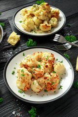 Roasted cauliflower with cheddar cheese sauce and herbs.