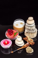 Pyramid of pebbles. Stones on the table. Rest for coffee. Wellness concept. Meditation with a candle.