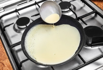 Cooking pancakes at the kitchen.