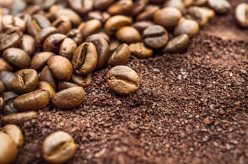 Background of ground coffee and coffee beans.