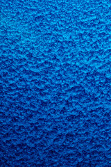 blue hammered metal background,abstract metalic texture, sheet of metal surface painted with hammer paint.