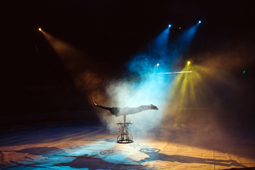 A man dancing in the circus arena.