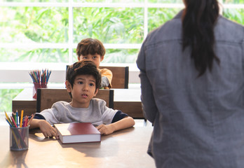 Boy worry and up set about teacher in classroom