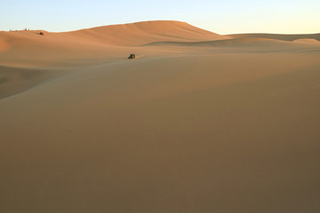 People enjoy dune buggy on the immense desert of Huacachina, Ica, Peru, South America