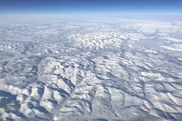 Wide aerial shot of the Bering Sea covered in snow in winter