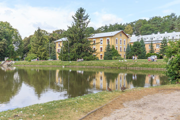 Fototapeta na wymiar Spa Park and Lake in Naleczow near Lublin in Poland. In background is Sanatorium 