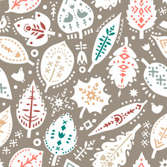 Vector seamless pattern of autumn leaves with ethnic ornaments.