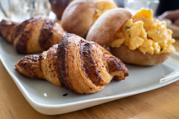 Croissants and scrambled eggs for breakfast
