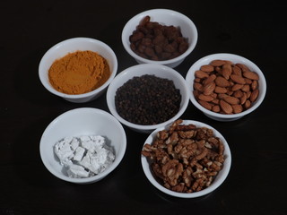 Turmeric, Kismish, Almonds, Badam, Akhrot, Walnuts, Chuna, Limestone, Haldi, Black Pepper, Kali Mirch, Wooden Background,