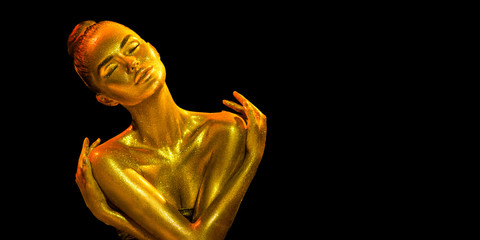 Golden skin woman portrait closeup. Sexy model girl with holiday golden shiny professional makeup....