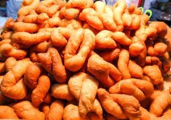 close up deep-fried dough stick in the market