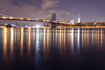 The Williamsburg bridge and Manhattan at night, New York.