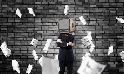 Businessman with old TV instead of head.