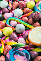 background from variety of sweets, lollipops, chewing gum, candies etc